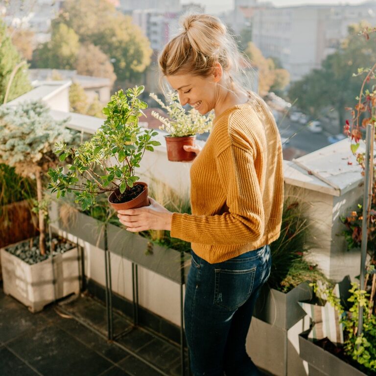 A woman planting new plants, plant patents concept