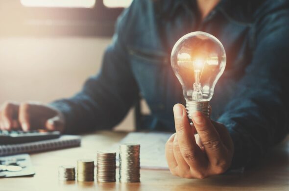 Lightbulb and money, hiring a patent attorney for a new invention concept