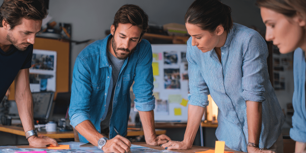 A team around a desk at a startup company planning their IP strategy