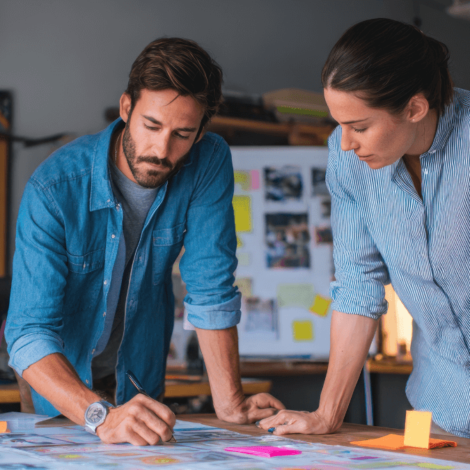 A team around a desk at a startup company planning their IP strategy