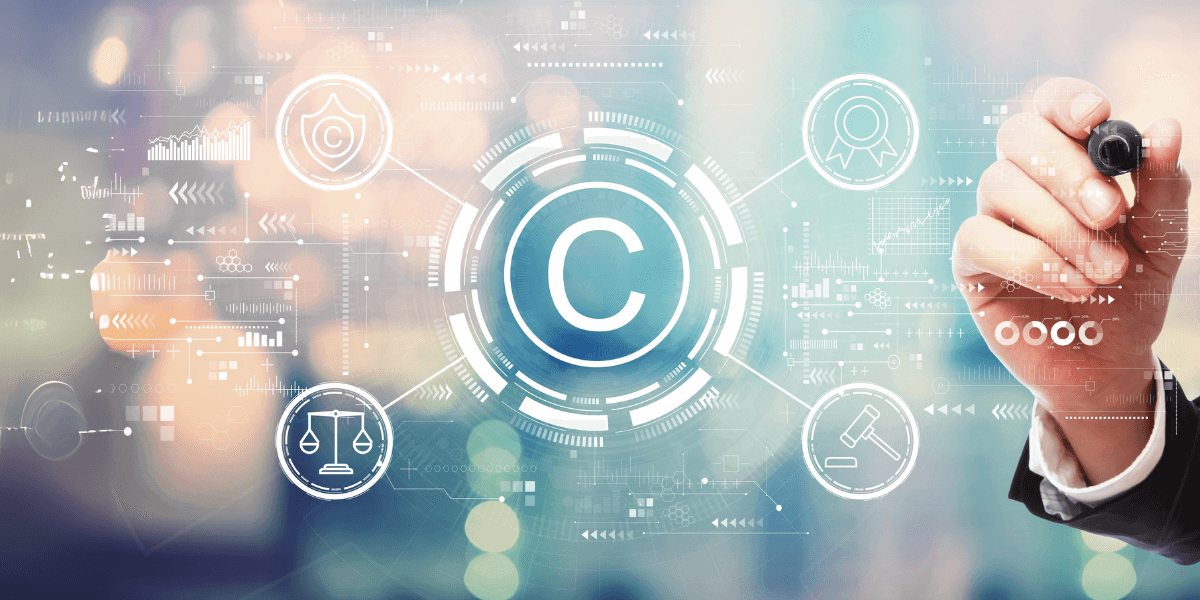 Basics of Copyright Law Person reviewing creative work with digital copyright symbol