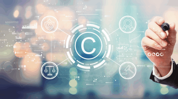Person reviewing creative work with digital copyright symbol