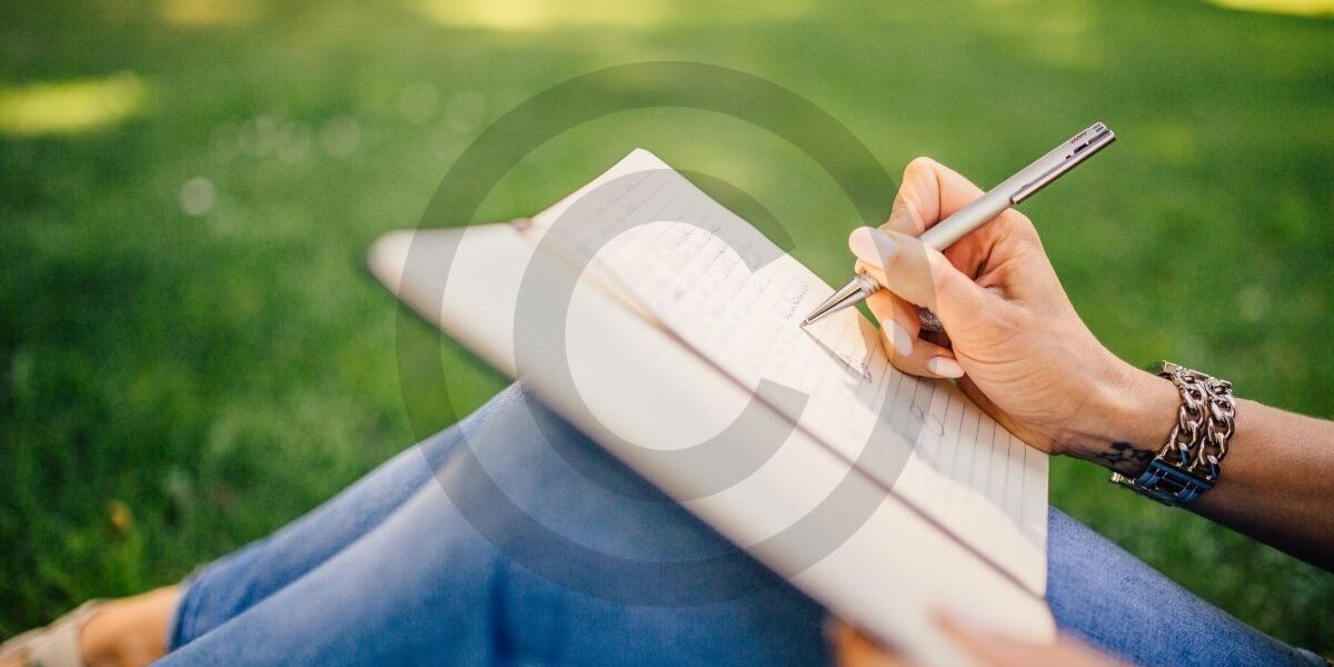 Writer working on a novel with copyright symbol overlay