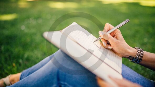 Writer working on a novel with copyright symbol overlay