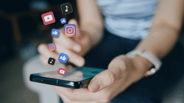 Person using a smartphone with social media app icons floating above, representing online sharing and copyright considerations for businesses.
