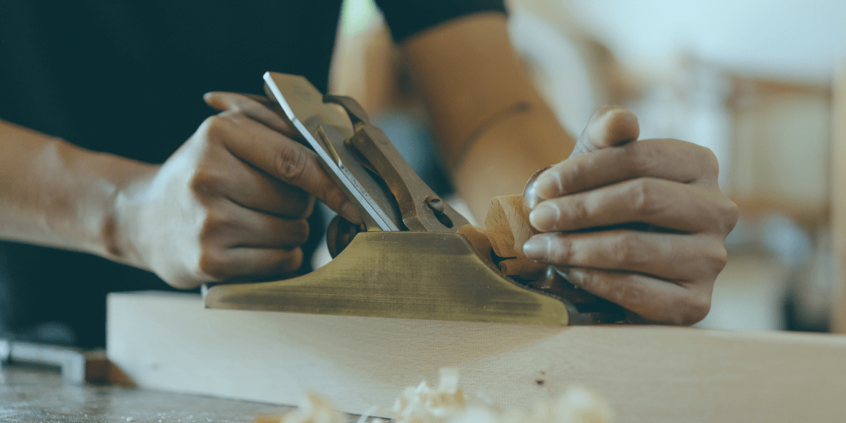 Person woodworking with tools