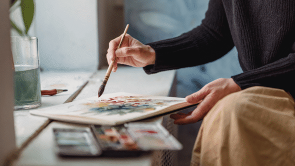 Woman painting an original work