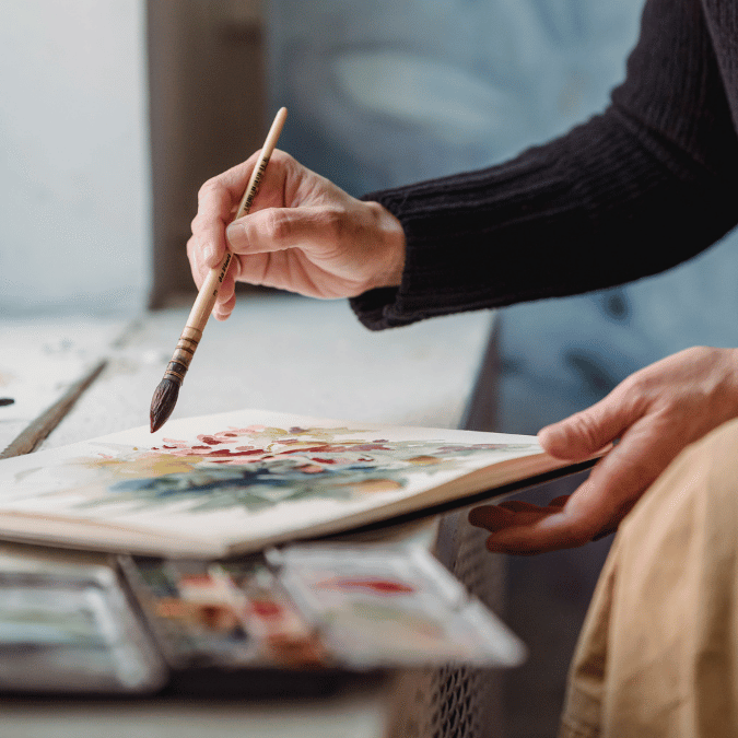 Woman painting an original work